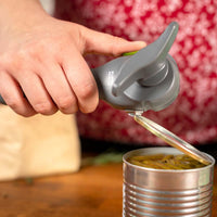 Grey Kuhn Rikon Auto Safety LidLifter Can Opener In Use