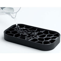 Black Lekue Ice Box Being Filled