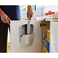 Joseph Joseph CleanTech Wall-Mounted Dustpan and Brush On Cabinet Door