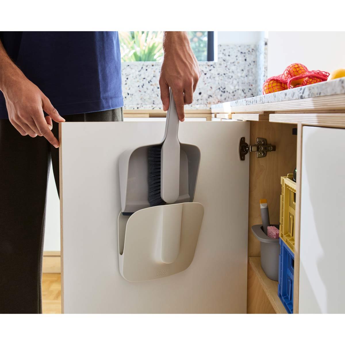 Joseph Joseph CleanTech Wall-Mounted Dustpan and Brush On Cabinet Door