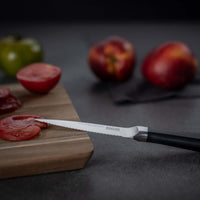 Kuhn Rikon Culinary Forged Paring Knife Serrated Lifestyle Side View