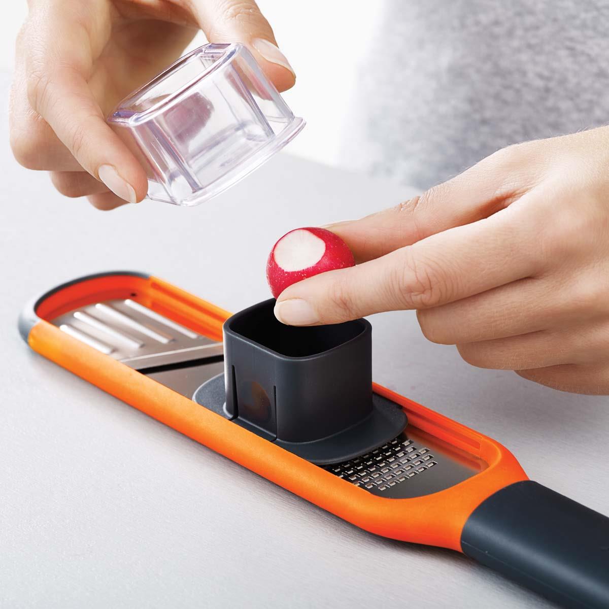 Orange Joseph Joseph Handi-Grate 2-in-1 Mini Grater and Slicer radish