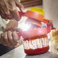 Orange Joseph Joseph JuiceMax Plus Citrus Juicer Lifestyle In Use