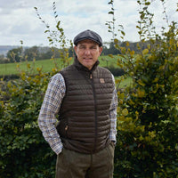 Willow Green/Shadow Brown Harkila Mens Kalix HSP Reversible Waistcoat Reverse Side On Vinnie Jones