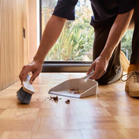 Joseph Joseph CleanTech Wall-Mounted Dustpan and Brush In Use