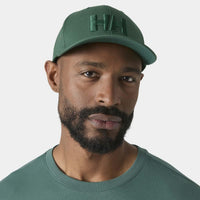 Opal Green Helly Hansen HH Brand Cap on model