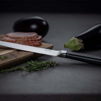 Kuhn Rikon Culinary Forged Carving Knife Lifestyle Angled