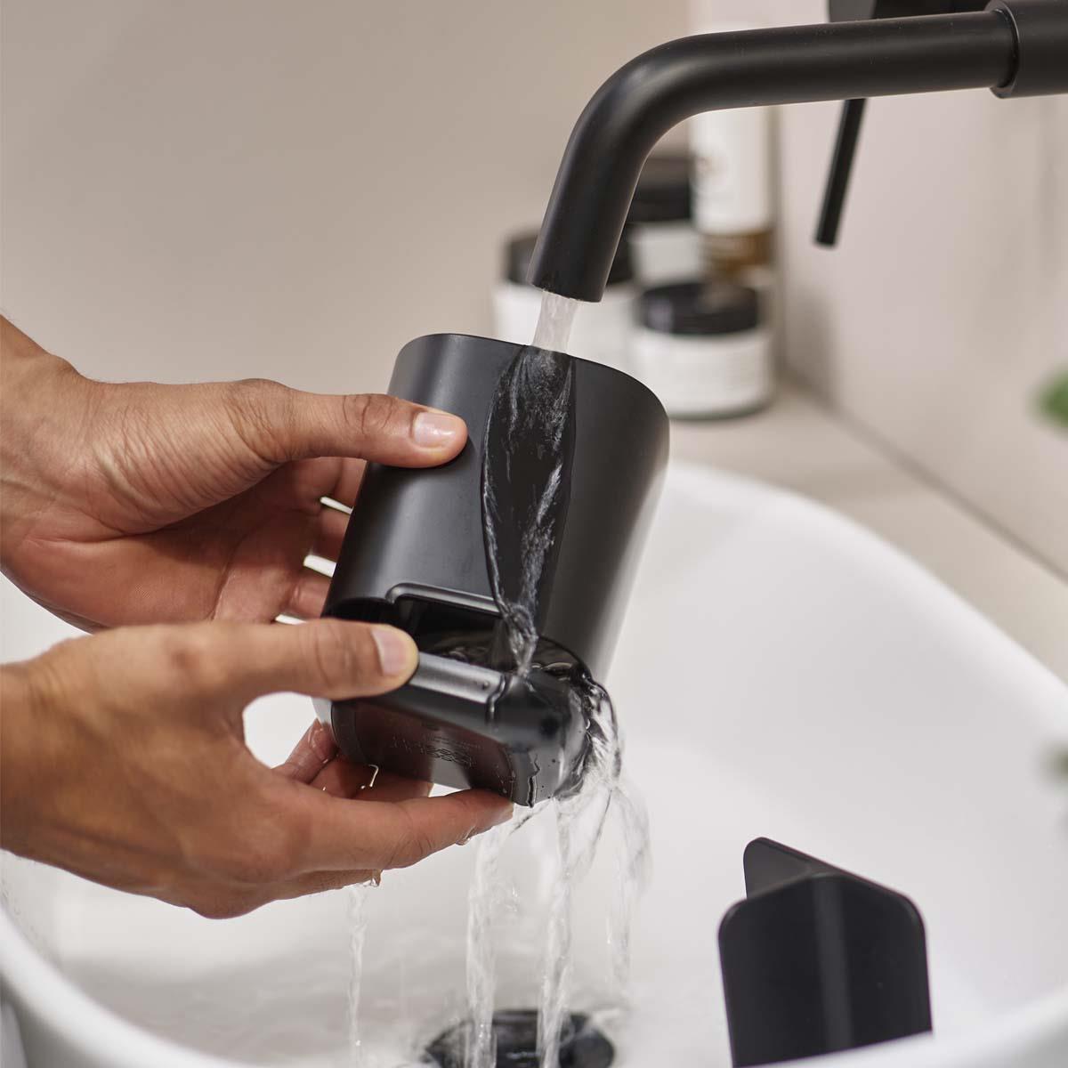 Black Joseph Joseph EasyStore Toothbrush Holder Being Cleaned