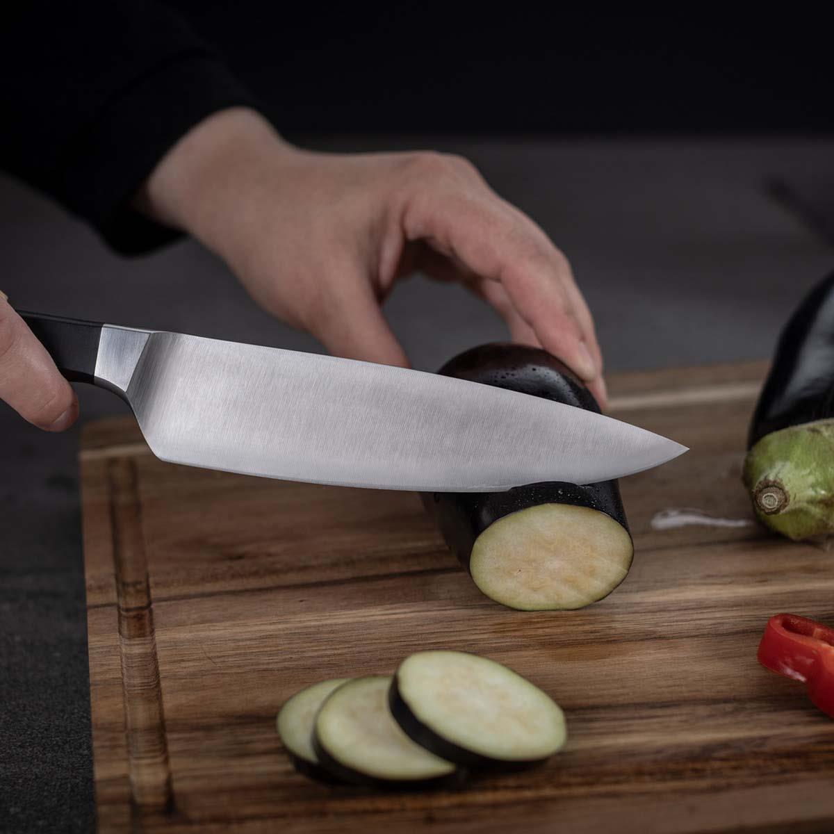 Kuhn Rikon Culinary Forged Chefs Knife Chopping