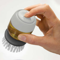 Grey Joseph Joseph Palm Scrub Brush press