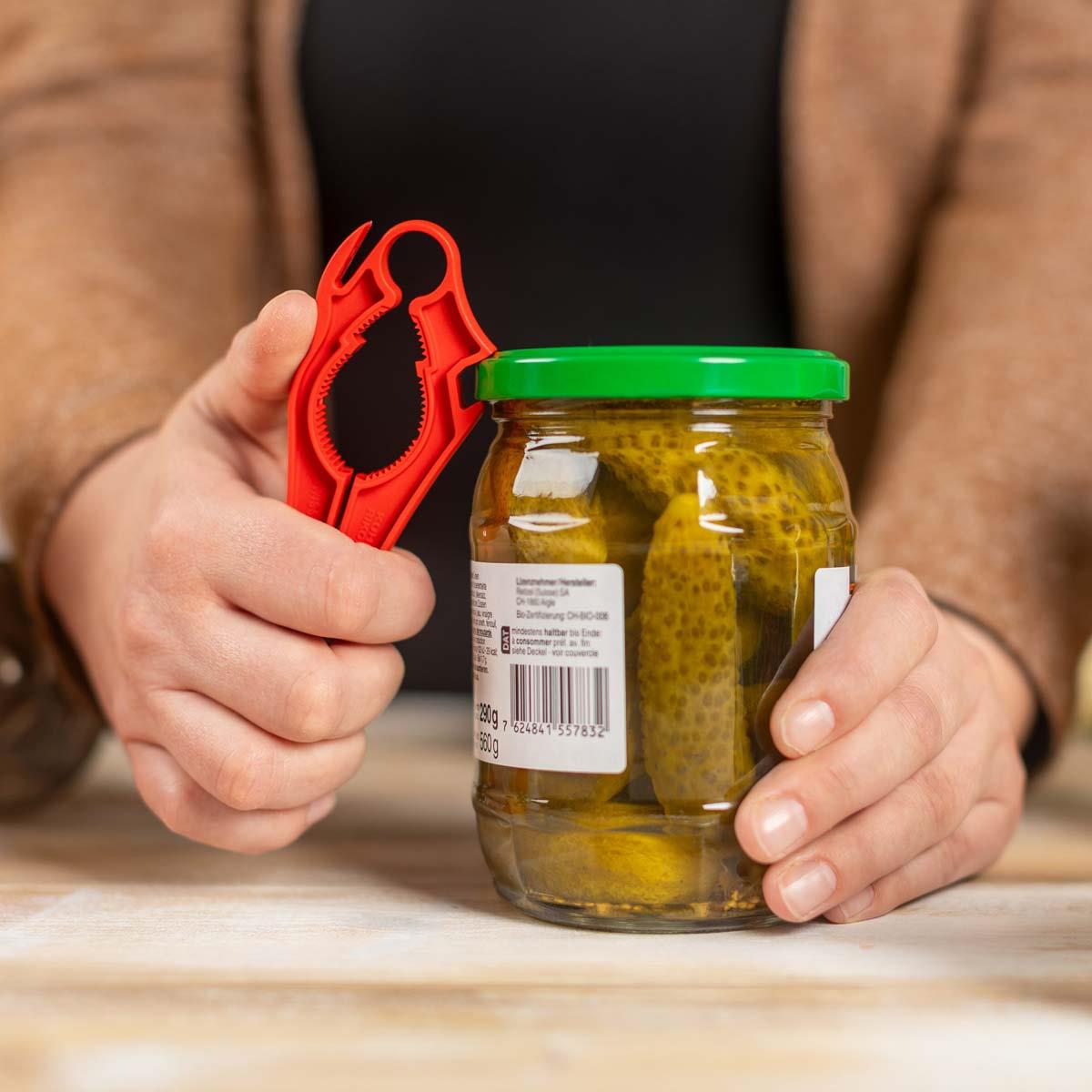 Kuhn Rikon 5-in-1 Swiss Multi Opener Breaking Seal on Jar