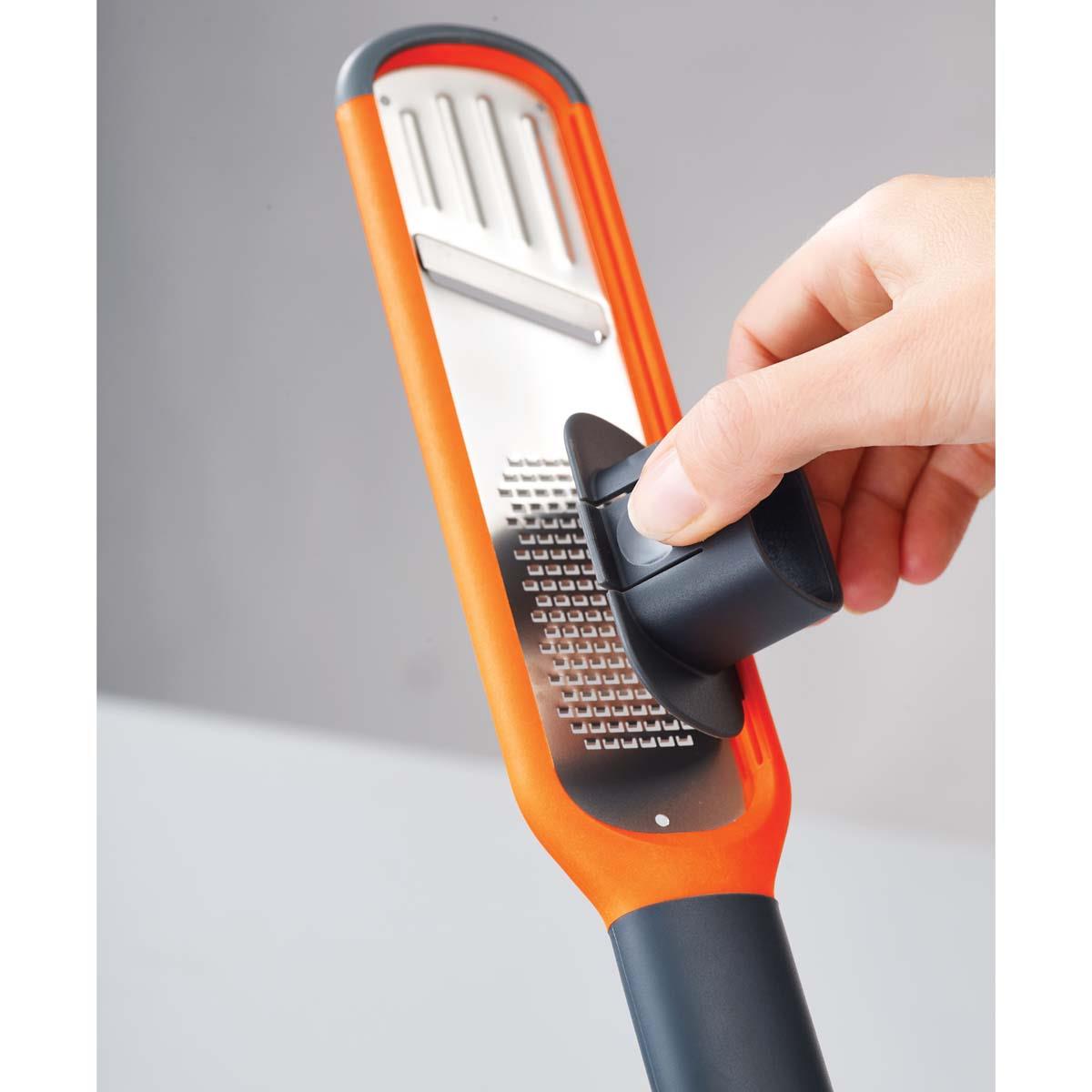 Orange Joseph Joseph Handi-Grate 2-in-1 Mini Grater and Slicer push