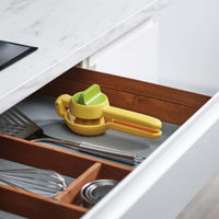 Yellow Joseph Joseph JuiceMax Dual-action Citrus Press storage