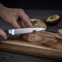 Kuhn Rikon Culinary Forged Utility Knife Serrated In Use